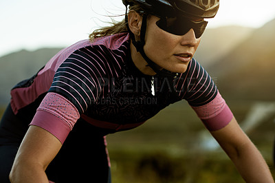 Buy stock photo Cycling, outdoor and woman with helmet in nature for exercise, fitness and training for triathlon. Sports, cyclist and person with sunglasses for adventure, workout and challenge for competition