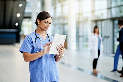 Buy stock photo Nurse, tablet and reading in hospital for medical schedule, information or review healthcare history. Technology, woman and worker in clinic to scroll email, update report and research on internet