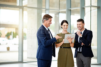 Buy stock photo Tablet, discussion and conference with business people in office for research, networking and seminar schedule. Convention center, agenda and collaboration with employees in lobby for project review
