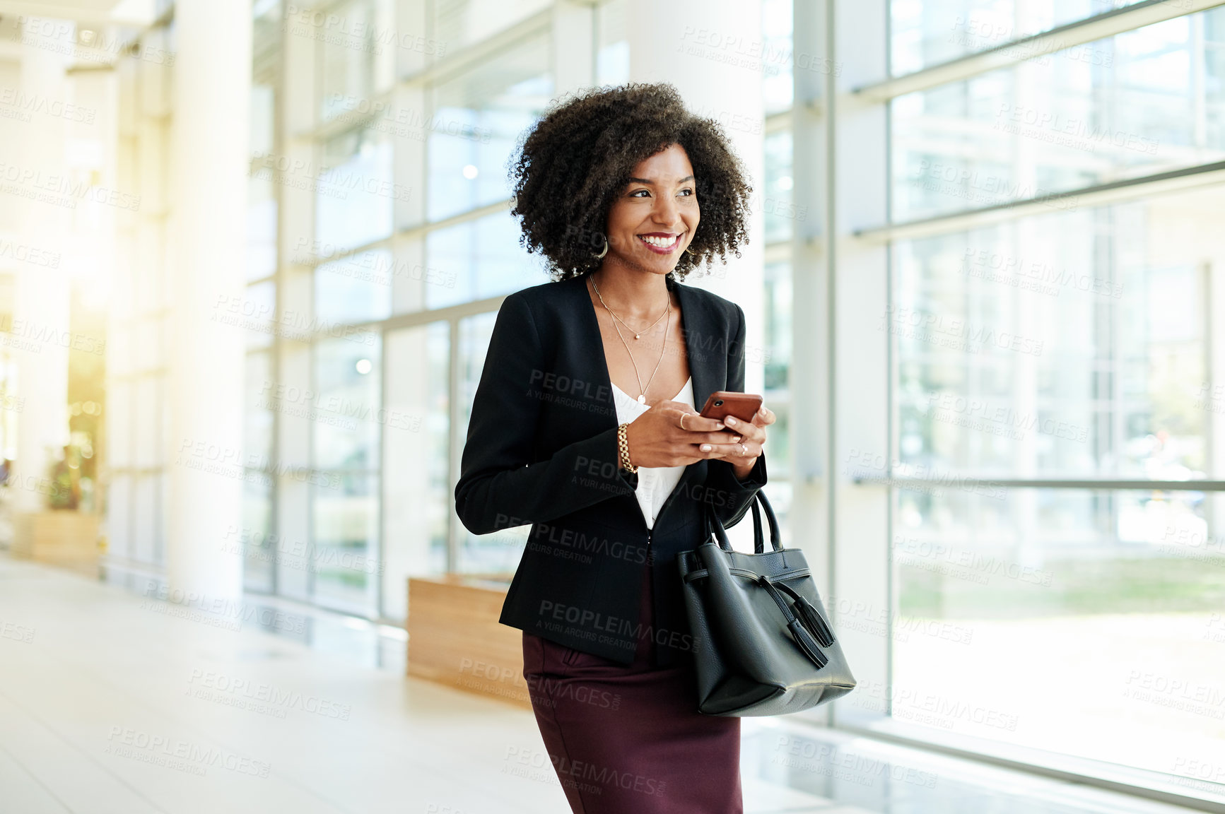 Buy stock photo Business, black woman and smile with phone in lobby for research, schedule and architecture. Person, architect and mobile for building planner, development reflection and chat for quality assurance