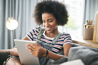 Buy stock photo Happy, house and black woman on sofa, tablet and texting with social media, email and internet. Smile, apartment and African person on couch, tech and message with connection, digital app and break