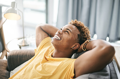 Buy stock photo Think, man and stretching on couch, home or stress relief in lounge, happiness or calm in apartment. Pride, African person or comfortable on sofa, positive attitude or rest on weekend, smile or break