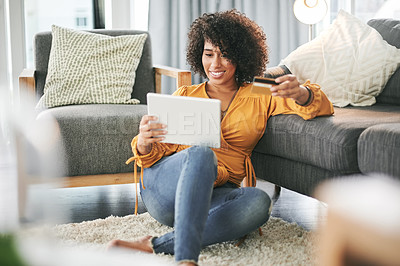 Buy stock photo Happy, woman and purchase with tablet, living room or card for online shopping, customer or payment. Relax, digital and African person with credit for discount, smile and tech for ecommerce in house