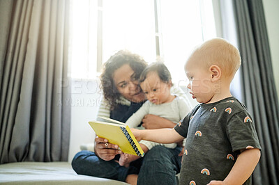 Buy stock photo Mother, babies and learning with book in home, storytelling and education in house. Development, care and happy mama reading with children, kids or toddlers while bonding and having fun together.