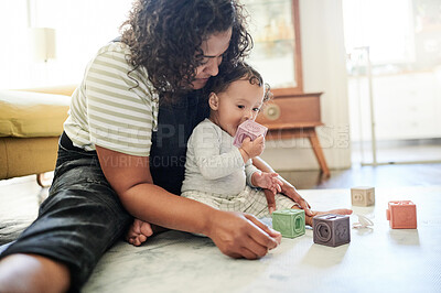 Buy stock photo Mother, baby and play with building blocks in home, learning and education in house. Development, care and mama playing game with child toys, toddler and newborn while bonding and having fun together