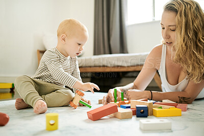 Buy stock photo Building blocks, mother and child playing with baby toys in a family home bedroom for fun. Woman or mom with toddler kid together for learning color, quality time and mobility or growth development