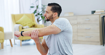 Buy stock photo Man, fitness and stretching arms in home for workout, exercise or indoor training on floor. Active, male person or physical activity with body warm up or preparation for health or wellness in house