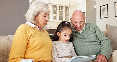 Buy stock photo Grandparents, relax and child at house with tablet, streaming and download games for education. Senior people, babysitting and girl in home with digital, internet search and online quiz for learning