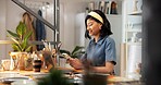 Pottery, woman and typing in small business with phone, online or post art listing on ecommerce app. Entrepreneur, person and update ceramics catalog in store with tech, shop website or clay product.