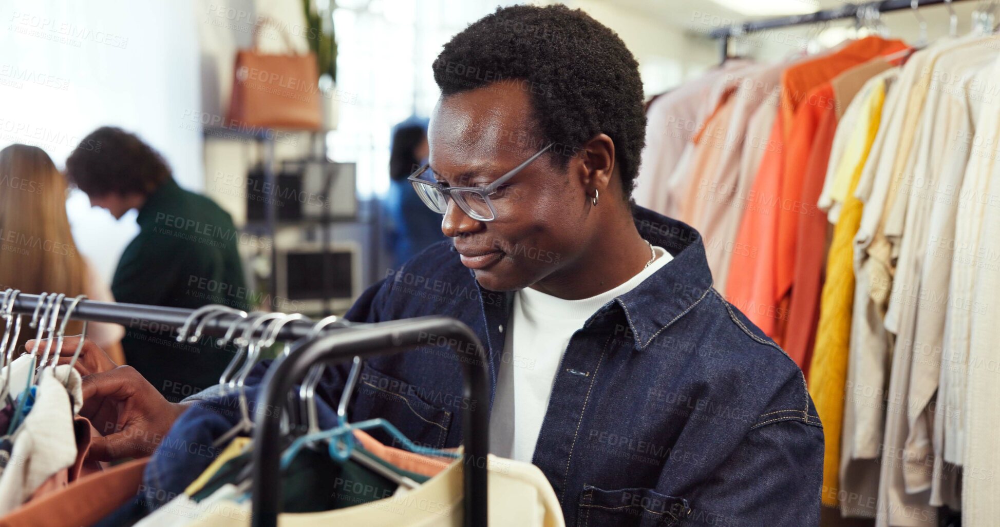 Buy stock photo Shopping, check or man in store with clothing rack, outfit search or decision in trendy style. Retail, smile or customer in boutique with apparel, garment choice or selection in fashion purchase.
