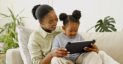 Buy stock photo Happy, mom and child with tablet in lounge, love and watching cartoons with subscription in home. Family, laughing and black woman with daughter, bonding and streaming movie with technology in house