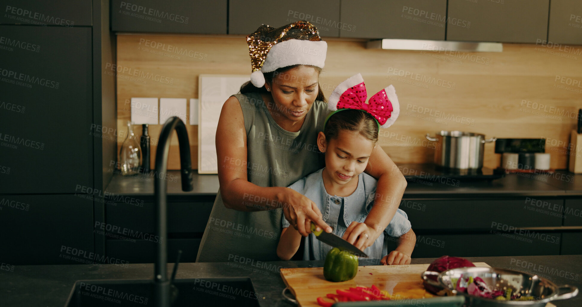 Buy stock photo Mother, child and help on Christmas with cooking, cut vegetables and support with holiday food. Bonding, mom or kid in home with meal prep, green pepper or salad ingredients for xmas lunch assistance