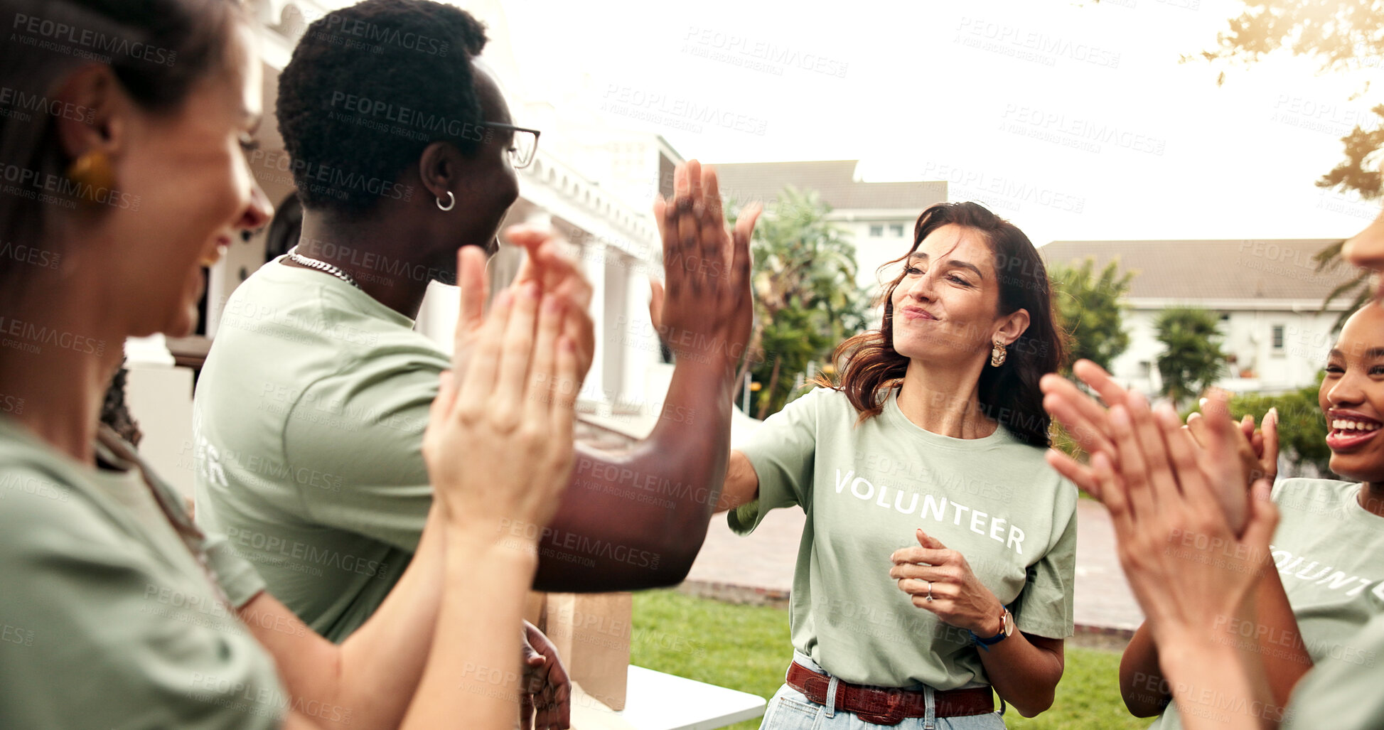 Buy stock photo Volunteer, high five and applause with happy team, outdoor and laughing with fundraising success. People, clapping and celebration for achievement, collaboration and social responsibility for NGO
