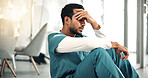 Nurse, man and medical stress on floor for grieving loss, operation failure and shift trauma. Health intern, professional and overwhelmed in hospital for healthcare crisis, ethical concern and worry