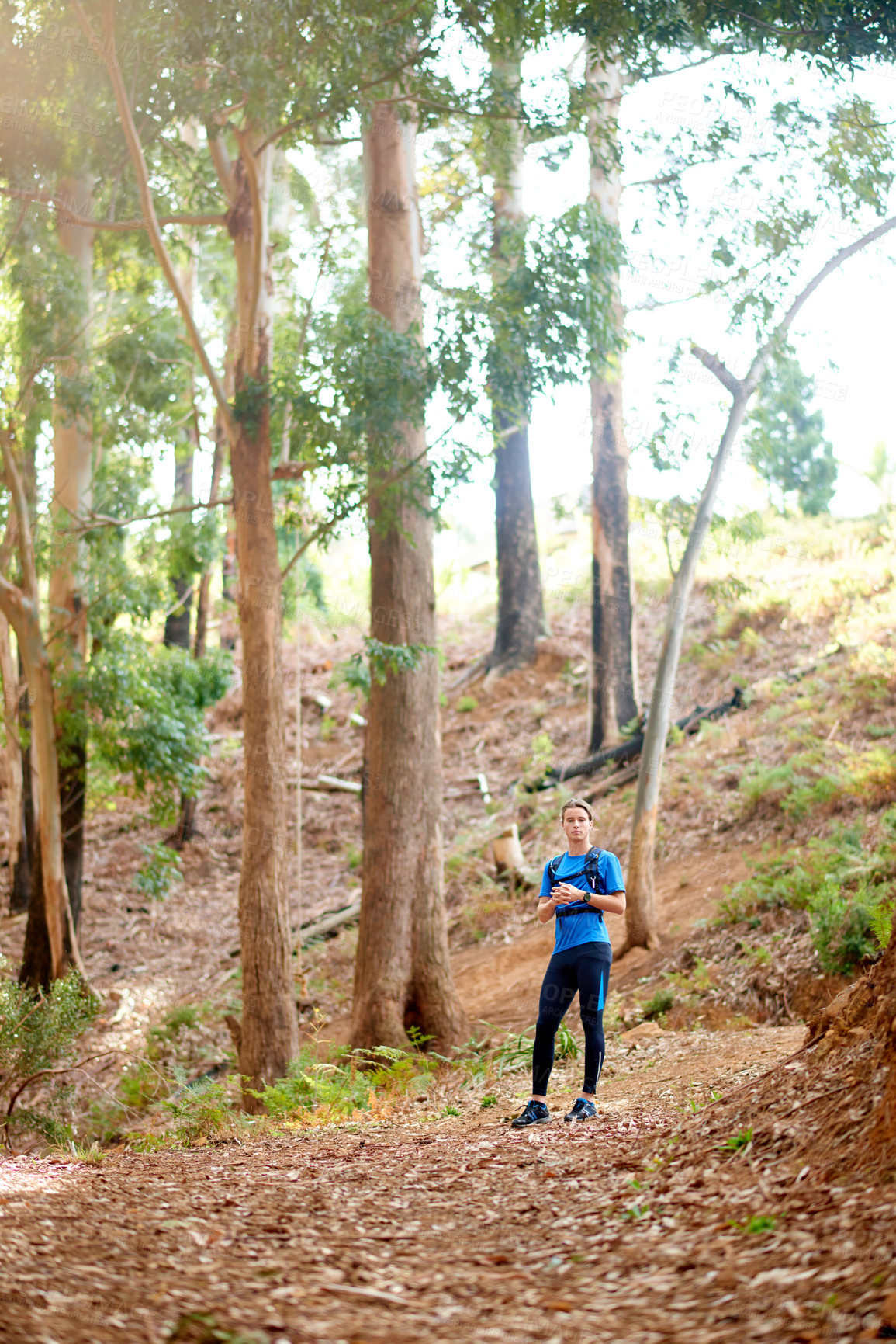 Buy stock photo Runner, fitness and man in nature for exercise, marathon training and cardio workout. Sports, forest and athlete in woods for wellness, healthy body and endurance for race, challenge and competition