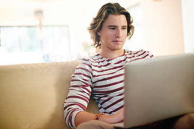 Buy stock photo Laptop, reading and man on sofa for application, thinking and university scholarship email in home. Tech, research and male student in living room for college admission test, exam or study assignment