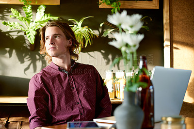 Buy stock photo Thinking, creative and man with laptop, cafe and remote work for digital magazine, employee and app. Reflection, reporter and person with tech for article, online or freelance project in coffee shop