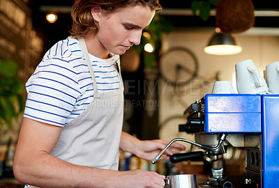 Buy stock photo Small business, barista and man in coffee shop, machine and skills with service. Person, startup and employee in cafe, waiter and prepare drink with order, morning and restaurant with milk foam