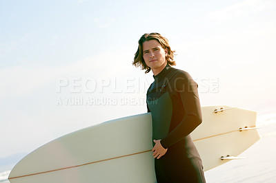 Buy stock photo Blue sky, surfer and man with surfboard at beach for water sports, adventure and surfing. Outdoor, nature and person by ocean, sea and waves for holiday, vacation and hobby on weekend in Portugal