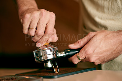 Buy stock photo Hands, barista and preparing coffee with portafilter, fresh brew or closeup of professional service for caffeine at cafe. Process, tools for premium blend and person in cafeteria for espresso