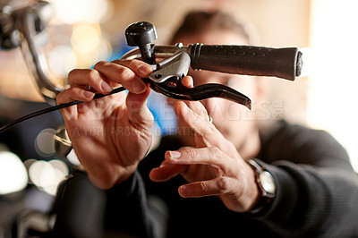 Buy stock photo Inspection, hands and man with handle, bike store and maintenance with small business. Closeup, person and employee with bicycle, fixing and check brakes with skills, repairs and eco friendly