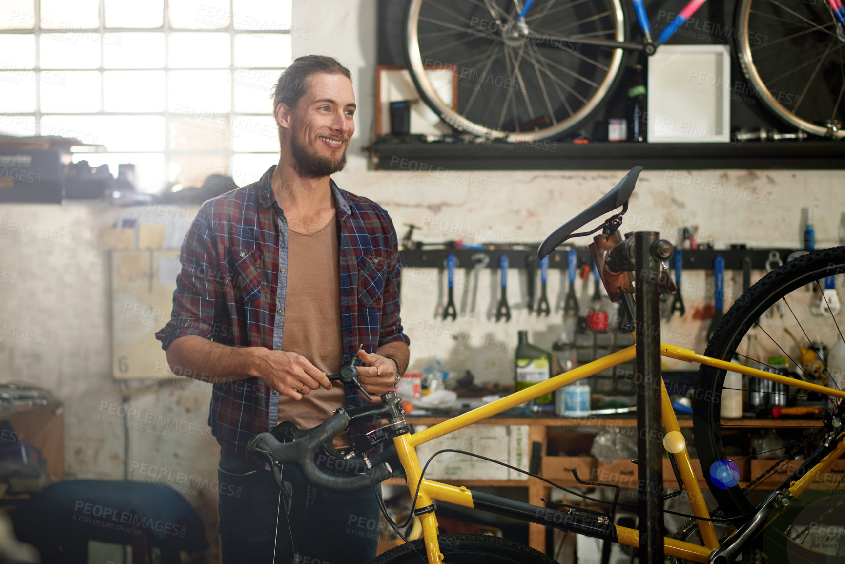 Buy stock photo Happy, technician and man with bicycle, shop and repairing eco friendly transport, think or service. Fixing, bike and person with ideas for maintenance, reflection or entrepreneur with smile in store