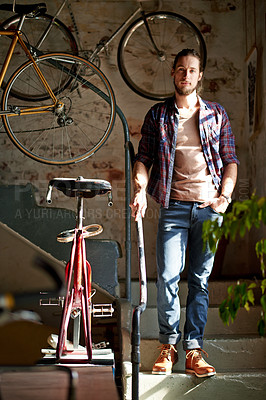 Buy stock photo Man, portrait and smile with bicycle, shop and vintage collection with small business owner on stairs. Person, entrepreneur and mechanic for sustainable company with retro bike restoration in France
