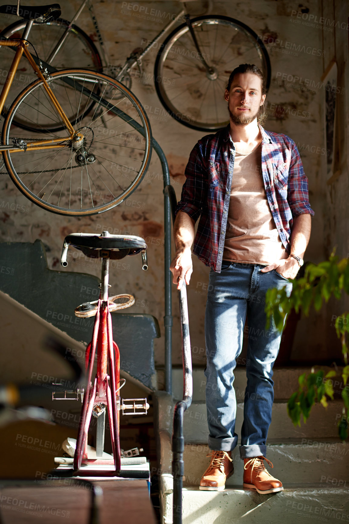 Buy stock photo Man, portrait and smile with bicycle, shop and vintage collection with small business owner on stairs. Person, entrepreneur and mechanic for sustainable company with retro bike restoration in France