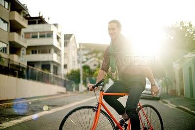 Buy stock photo Travel, commuting and man on bicycle in city for adventure, journey or carbon footprint on holiday. Street, cycling and person on bike for eco friendly transport on vacation in urban town by sunset.