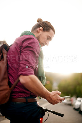 Buy stock photo Entrepreneur, phone or man on bicycle in city for eco friendly transport, commute or outdoor travel. Search, texting or designer in urban town with location, mobile app or bike for online directions