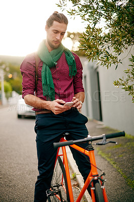Buy stock photo Address, phone or man on bicycle in street for eco friendly transport, commute or city travel. Outdoor, texting or male designer in urban town with location, mobile app or bike for online directions