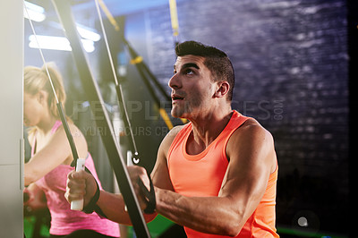 Buy stock photo Fitness, man and suspension trainer in gym for body, wellness and bodybuilding exercise. Active, challenge and male athlete in training class with cable equipment for muscle power, workout or cardio