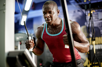 Buy stock photo Training, fitness and machine with black man in gym for cable rows, exercise and muscle development. Workout equipment, athlete and strong with intense person in sports club for bodybuilder reps