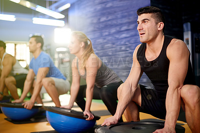 Buy stock photo Medicine ball, squat and people with personal trainer in gym for core strength workout together. Fitness, equipment and athletes with health coach for balance training with wellness in sports center.