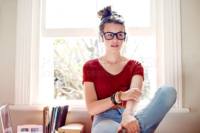 Buy stock photo Girl, student and headphones with glasses in home, streaming or sound with listening to music by books. Teenager, nerd and audio with subscription, study break and learning with scholarship at window