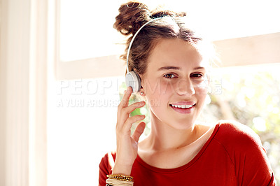 Buy stock photo Girl, smile and portrait in home with headphones, relax and pleased with streaming subscription for music. Teenager, wireless tech and happy at window for song album, new release and favorite audio