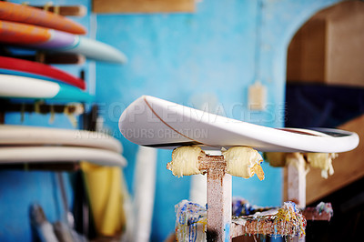Buy stock photo Design, store and surfboard in workshop for manufacturing, fixing or maintenance. Artistic production, hobby and creative wooden craft in small business for surf shop studio or renovation processes