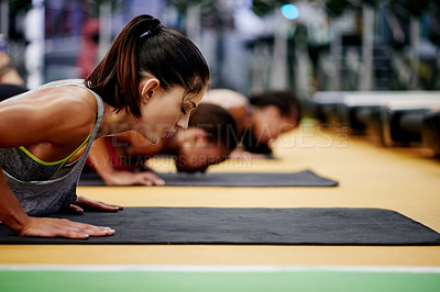 Buy stock photo Fitness, women and push up in gym for exercise, arm muscle development or group challenge. Bodybuilder, workout class and personal trainer with team for strength, commitment and wellness in club