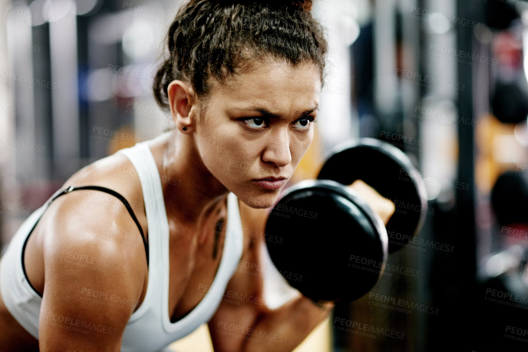 Buy stock photo Exercise, woman and dumbbell for weightlifting, workout and fitness in gym for health and power. African person, bodybuilder and endurance for muscle development, challenge or training for wellness