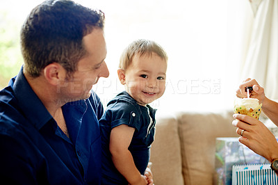 Buy stock photo Birthday, candle or cupcake with parents and son in living room of home together for party. Celebration, dessert or milestone with happy boy child, mom and dad in apartment for development or growth