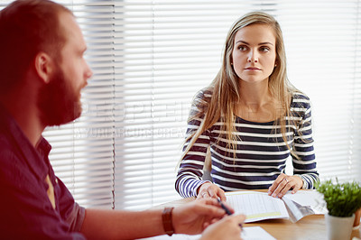 Buy stock photo Woman, team and office meeting at startup with documents, proposal or review for planning at media company. People, man and paperwork for insight, talk or collaboration for project at creative agency