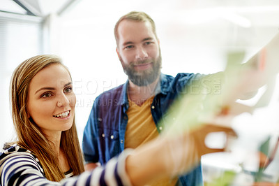 Buy stock photo Happy, business people or writing with schedule planning in office for agenda, tasks or project. Creative man, woman or colleagues with glass board for company strategy or brainstorming together