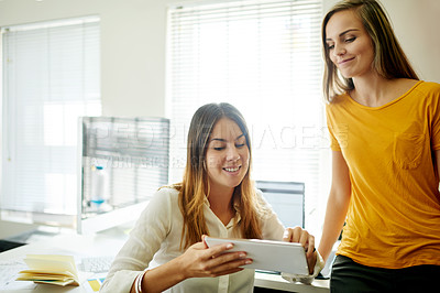 Buy stock photo Collaboration, smile and tablet with business women in office together for planning or research. App, information and reading with employee team in workplace for administration or online report