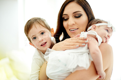 Buy stock photo Mom, child and hug with baby for family love, support or motherhood together in home. Mother, son and holding infant with sibling, smile or embrace for comfort, growth or childhood parenting in house