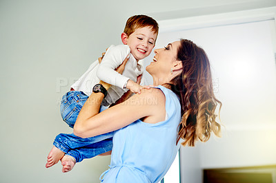 Buy stock photo Smile, mother and lift child in home for love, support and laughing together with son. Mom, kid and playing with parent for funny game, bonding and connection with boy for care with family in house
