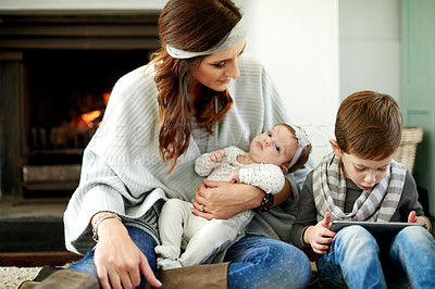 Buy stock photo Mom, baby and child with tablet in home with education games for brain development. Parent, kids and happy on floor in living room with internet, streaming cartoon and app for entertainment or growth