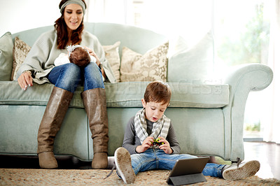 Buy stock photo Mom, baby and child with tablet in living room for movies, games or brain development app. Parent, son and mother on floor in home with internet, streaming or cartoons for entertainment or growth