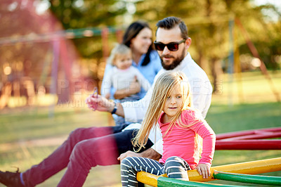 Buy stock photo Playground, happy and parents with kids in park for bonding, playing games and having fun. Family, sunlight and playful mom, dad and children outdoor for holiday, adventure and activity on weekend