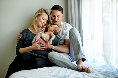 Buy stock photo Bedroom, morning and parents with child in home for loving relationship, bonding and affection. Family, calm and happy mom, dad and newborn baby in house for security, trust and parenting together