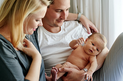 Buy stock photo Bedroom, happy and parents with baby in home for loving relationship, bonding and affection. Family, people and mother, father and newborn in house for security, parenting and connection together